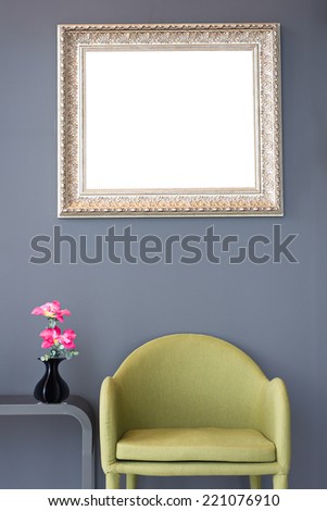 Modern design of lounge room green chair pink flowers vintage photo gold frame retro with clipping path.