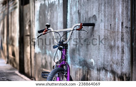 Old vintage bmx bike on the street  bicycle near the concrete wall.