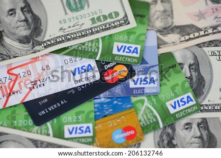 KIEV, UKRAINE - on May 8: Heap of credit cards, Visas and MasterCard, with US dollar accounts, Ukraine, on May 8, 2014.