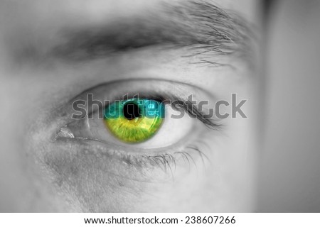 Men portrait with eyes the color of Ukrainian flag