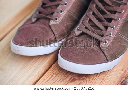 sneakers on wooden deck