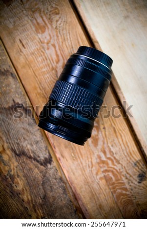 profesialny lens on a wooden background