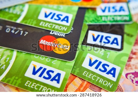 KIEV, UKRAINE - on June 15: Heap of credit cards, Visas and MasterCard,, Ukraine, on june 15, 2015.Pile of Visa credit cards. Visa and master card is biggest credit card.