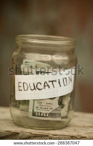 Jar with coins labeled education.