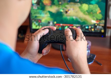 Man hand playing a computer games