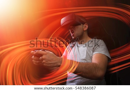 addicted young man playing a virtual reality video game; video game addiction futuristic concept