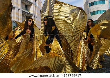 LEMESOS,CYPRUS - FEBRUARY 26: People of all ages ,gender and nationality in colorful costumes have fun during the famous annual street carnival parade on February 6, 2012 in Lemesos, Cyprus.
