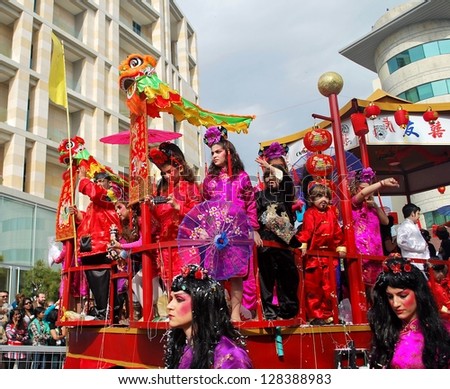 LIMASSOL,CYPRUS - MARCH 3, 2011:Grand Carnival Parade - People of all ages ,gender and nationality in colorful costumes have fun during the famous street carnival on March 3, 2011 in Limassol, Cyprus.