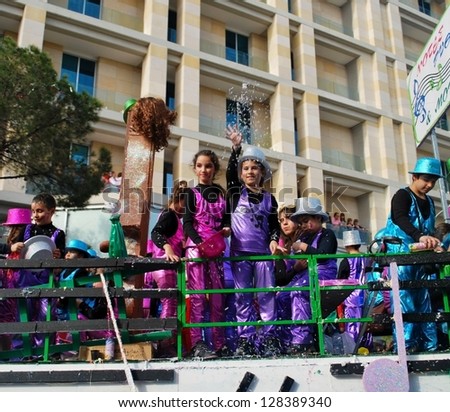 LIMASSOL,CYPRUS - FEBRUARY 26, 2012:Grand Carnival Parade - an unidentified children of all ages in colorful costumes have fun during the street carnival on February , 2012 in Limassol, Cyprus.