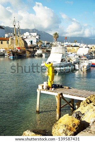 KYRENIA,NORTH CYPRUS -JANUARY 20, 2013:Picturesque small harbor in the center of the city offers the opportunity for fishing,boat trip and other activities in Kyrenia,North Cyprus on 20 january 2013