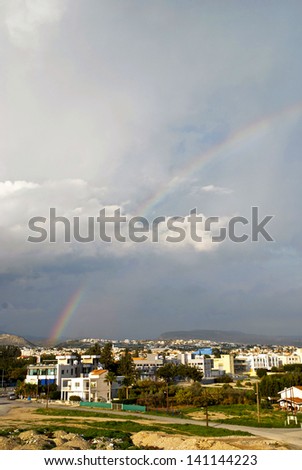Rainbow over the city after storm