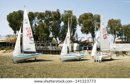 LIMASSOL,CYPRUS-APRIL 06, 2013:Sailboats from the local club, dock on the city beach ready for training in Limassol,Cyprus in april 06, 2013