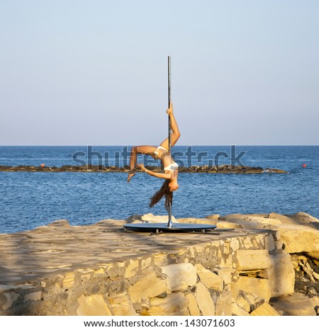 LIMASSOL,CYPRUS-JUNE 16,2013:Performance of acrobatic program for tourist attraction on the beach of Limassol,Cyprus on june 16,2013