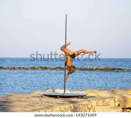 LIMASSOL,CYPRUS-JUNE 16,2013:Performance of acrobatic program for tourist attraction on the beach of Limassol,Cyprus on june 16,2013