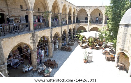 NIKOSIA,NORTHERN CYPRUS-JUNE 10,2013: Buyuk Han (Great Inn) turned into a tourist center with an antique shop and souvenirs, craft workshops and ateliers in Nicosia, Northern Cyprus on june 10,2013