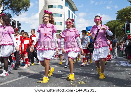LIMASSOL,CYPRUS - MARCH 10, 2013:Grand Carnival Parade -an unidentified people of all ages ,gender and nationality in colorful costumes during the street carnival on March 10,2013 in Limassol, Cyprus.