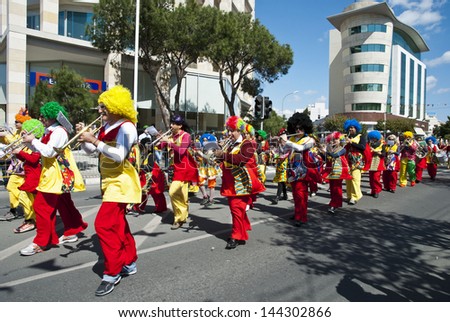 LIMASSOL,CYPRUS - MARCH 10, 2013:Grand Carnival Parade -an unidentified people of all ages ,gender and nationality in colorful costumes during the street carnival on March 10,2013 in Limassol, Cyprus.