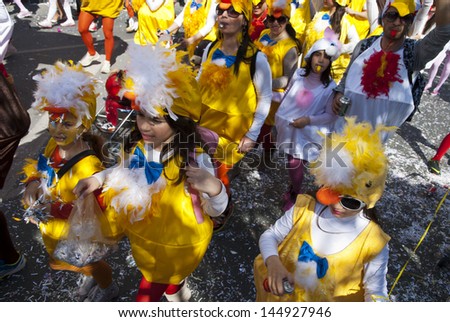 LIMASSOL,CYPRUS - MARCH 10:Grand Carnival Parade -an unidentified people of all ages ,gender and nationality in colorful costumes during the street carnival on March 10, 2013 in Limassol, Cyprus.
