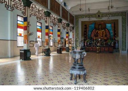 HO CHI MINH CITY - FEBRUARY 14: An unidentified priest walks in a Buddhistic temple on February 14, 2007 in Ho Chi Minh, Vietnam. A significant number of religions co-existed in Vietnam for centuries.