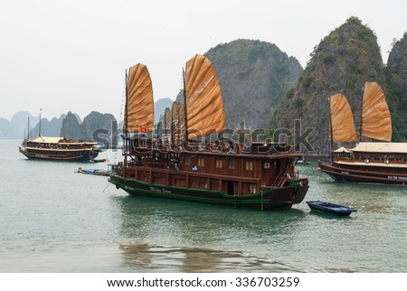 Ha Long Bay, Vietnam - January 15, 2008: Ships in traditional style carry tourists. Ha Long Bay is a UNESCO World Heritage Site and a popular travel destination in Vietnam.