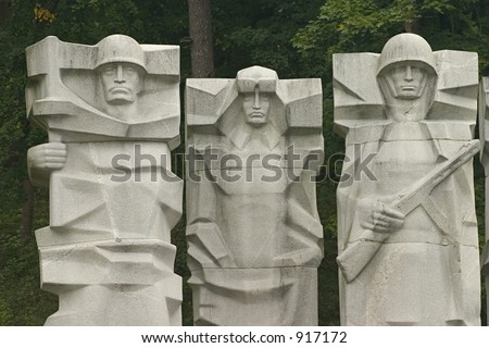 Three communist-era statues at a cemetery in Vilnius, Lithuania.
