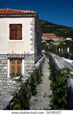 The wall of the old city of Budva, Montenegro.  It is possible to walk around the city on the ramparts.