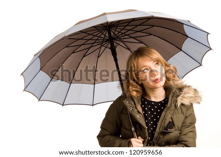 Attractive young woman with an umbrella looking up at the sky watching the weather for rain isolated on white