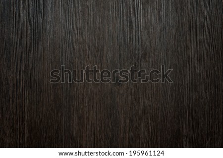 Dark brown rustic background made of a clean processed wooden surface