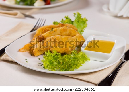 Chicken Fingers with Honey Mustard Sauce on Plate at Place Setting