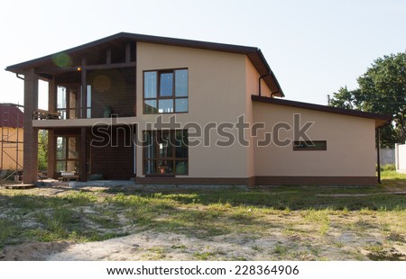 Attractive Exterior Design of Architectural Real Estate Model House on Grassy Landscape.