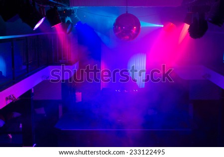 Empty Night Club Lit by Colored Spotlights