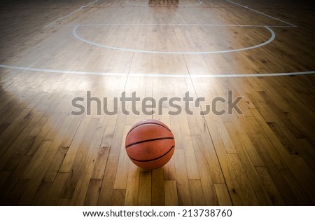 Basketball ball over floor in the gym