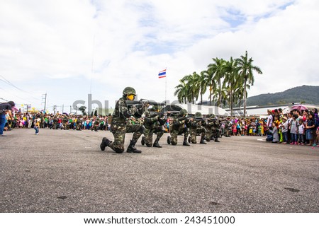 HATYAI THAILAND - JANUARY 10 :Children day, Show soldiers firing guns in the children\'s day at Royal Thai Army on January 10, 2015 in Hatyai Thailand.