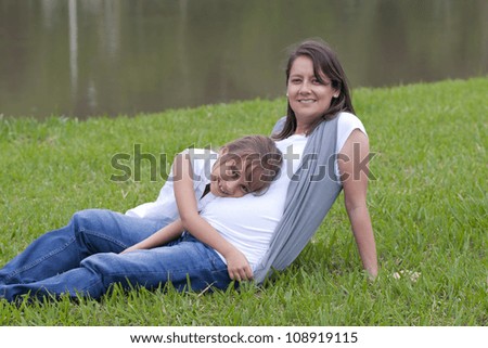Portrait of Family,Pregnancy Woman And Her Little Daughter Enjoying Outdoor