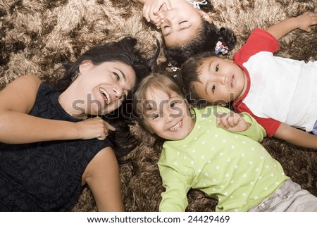 Portrait of family, mom and children enjoying indoor