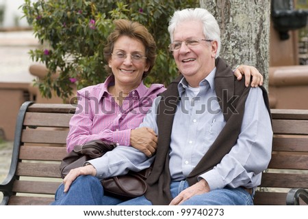 Happy Senior Couple In The Park Otdoor