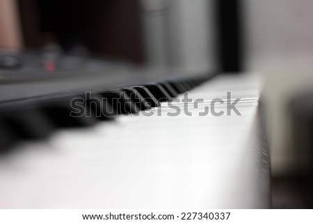 dark and white keys of a piano as background music