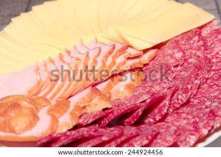 pieces of sausage and cheese as an element of food