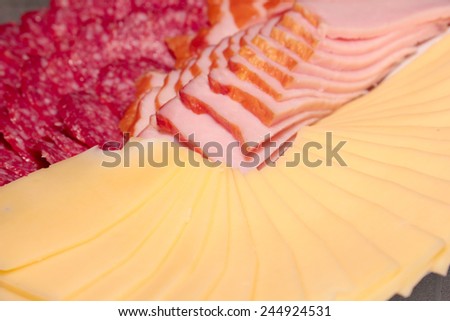 pieces of sausage and cheese as an element of food