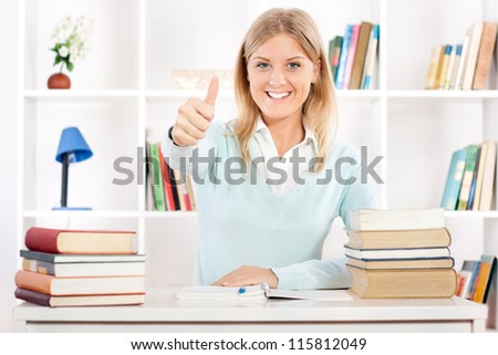 Beautiful young student showing thumb up,Student