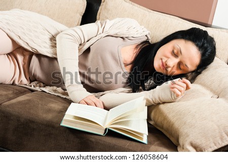 Beautiful young woman had fallen asleep while reading a book,Time for a nap