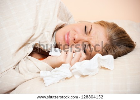 Young woman is lying in bad and crying,Crying woman