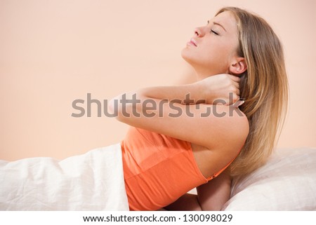 Young woman is having pain in her neck,Neck pain
