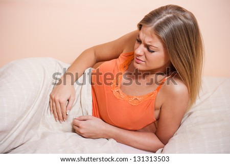 Young woman having pain in stomach,Stomachache