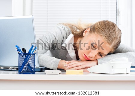 Beautiful tired business woman sleeping at work,Tired businesswoman
