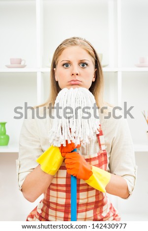 Young housewife is angry because she has to cleaning,Angry housewife