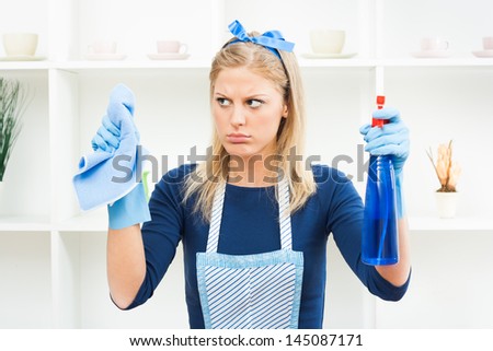 Young housewife is tired of cleaning,Fed up of cleaning