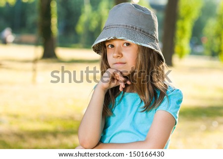 Little girl is thinking about something,Little girl in doubt