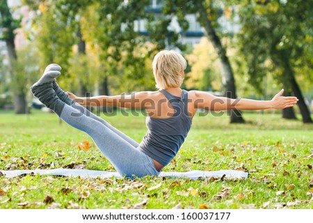 Young woman practicing yoga in the park,Yoga
