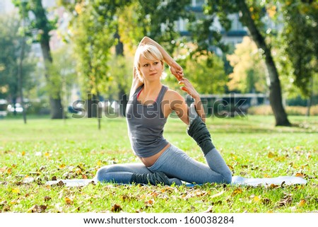 Young woman doing yoga in the park,Yoga
